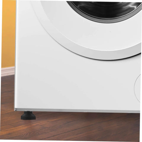 Close-up of a washing machine installed with heavy duty cabinet leveling feet set of four with screw adjustment rubber pads on wooden floor.