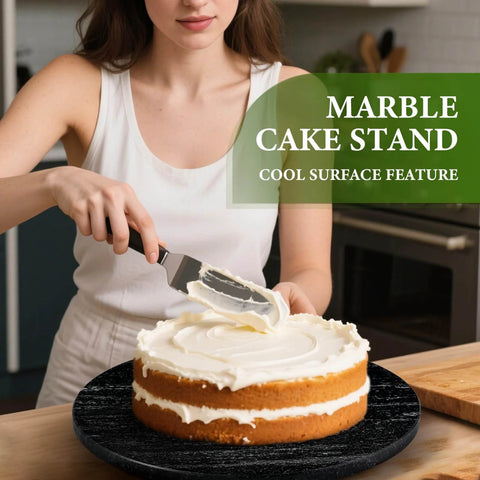 16 inch black marble lazy susan for kitchen use, natural stone rotating serving and organizer tray with a cake being frosted.