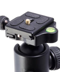 Close-up of Three Piece Round Bubble Level Set 12x6mm Mini Circular Bullseye Spirit Levels on camera tripod mount