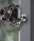 Universal Wall Mount Bracket With Adjustable Metal Arm For Action Cameras And Smartphones attached with camera on wall