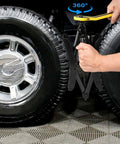 Beefy Heavy Duty Camper Wheel Chocks With Wrench For RV Travel Trailers, Premium X Shaped Tire Locking Chocks, 2 Pack, Fits 3.5 To 12 Inch Wheel Gaps, Durable Steel Construction, Gickbusus, installed between tires with wrench in use.