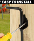 Installing 12 Inch Heavy Duty Cane Bolt Gate Drop Rod Ground Latch on wood fence with screwdriver; corrosion resistant black solid steel.