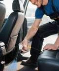 Man using powerful dry air car cleaning gun delivers fast interior detailing by blasting dust and debris with high velocity air.
