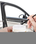 Applying Door Car Grease Multifunctional Rails Lubricant on car door hinge with brush, enhancing smooth operation for sunroof hinges and locks.