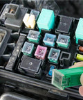 Car Fuse Box Shaped Combo Kit With Tall Standard And Low Profile Fuses For Ford Chevy GM Nissan Toyota Trucks Cars And SUVs In 20A 30A 40A 50A And 60A 30 Piece Set Easy To Organize Durable High Quality shown with hand replacing fuse