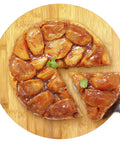 14 inch bamboo lazy susan organizer designed for cabinets and pantries, round bamboo turntable with apple tart on top.