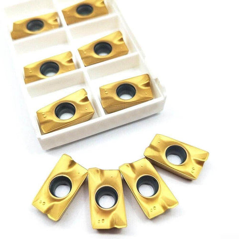 Close-up of 10 APKT1604 carbide inserts from the Pro Grade C20 20 120L Indexable Chamfer End Mill Cutter Set for cast iron processing.