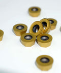 Close-up of RPMT1204 inserts from the Beefy 50mm EMR Round Dowel Face Mill Kit With Four Slot High Efficiency Cutter for multi-edge milling.