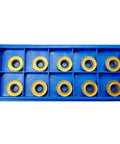 Blue tray with 10 RPMT1204-M-C DP5320 carbide inserts from Face Milling Cutter Holder Kit With 10 RPMT1204-M-C DP5320 Carbide Inserts And R8 FMB22 7 16th Shank Shell Mill Arbor, Essential Wrenches Included, Pro-Grade Build For Precision CNC Machining And Efficient Milling Of Thin Materials.