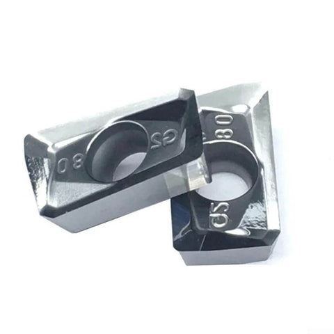 Close-up of two carbide milling inserts from the 10 Pack APKT1604PDFRG2 Carbide Milling Inserts for Aluminum Finishing and Semi Finishing.