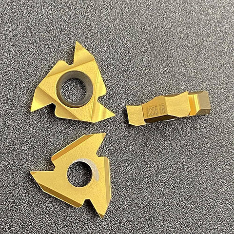 Carbide Threading Inserts 10 Pack 16IR AG55 Gold Coated For SER And SEL Threading Holders, shown on a textured surface