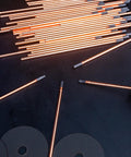 Carbon Arc Gouging Rods Set 10 Pcs 6mm X 305mm Copper Graphite Coated Welding Electrodes on dark surface
