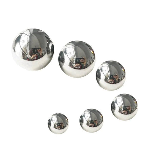 Various sizes of Carbon Steel Bearing Balls on white background, showcasing Precision Balls from 9mm to 20mm, used for high-strength applications.