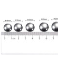 Assorted steel bearing balls measured, showcasing 20pcs 20mm Carbon Steel Bearing Balls Precision Polished with size comparisons