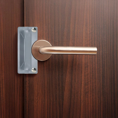 Installed view of Four Pack Latch Guard Plate Covers 3 By 7 Inches Carbon Steel With Screws Gaskets And Nuts Easy To Install Door Lock Protector Striker Cover For Outswing Exterior Doors Included Pack Of Four For Multiple Doors on wooden door.