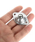 Hand holding a single unit from 16 Pack 1/2" Roller Ball Transfer Bearings, Carbon Steel Ball Transfer Unit Swivel Ball Caster Roller Transfers.