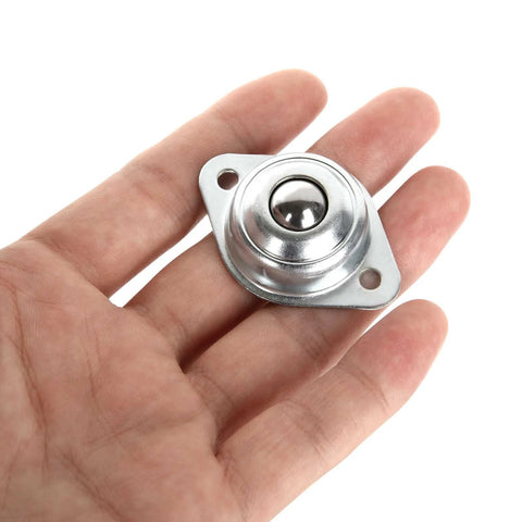 Hand holding a single unit from 16 Pack 1/2" Roller Ball Transfer Bearings, Carbon Steel Ball Transfer Unit Swivel Ball Caster Roller Transfers.