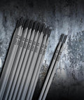 Premium E4303 J422 Carbon Steel Welding Rods arranged on metallic surface