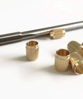 Throttle Shaft Bushing Repair Kit for Carburetors Five Sixteenth Shaft With Eight Brass Bushings and One Reamer Includes Nine Point Four Millimeter Knife Edge and Seven Point Nine Millimeter Shank Pilot for Experienced Mechanics showing brass bushings and reamer