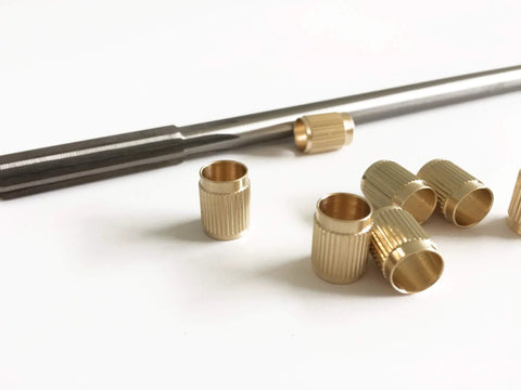 Throttle Shaft Bushing Repair Kit for Carburetors Five Sixteenth Shaft With Eight Brass Bushings and One Reamer Includes Nine Point Four Millimeter Knife Edge and Seven Point Nine Millimeter Shank Pilot for Experienced Mechanics showing brass bushings and reamer