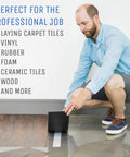 Man applying Heavy Duty Double Sided Carpet Tape 2 Inch By 40 Yard For Rug And Carpet Underlayment on floor tiles.