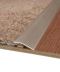 1-3/8 in. X 36 in. Pewter Aluminum Carpet Trim w/Screw Nails installed between carpet and wood floor