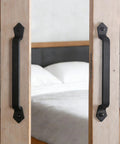 Heavy Duty Cast Iron 11-Inch Barn Door Handle For Sliding Doors, Vintage Long Gate Pull, black finish on wooden doors.