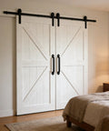Heavy Duty Cast Iron 11-Inch Barn Door Handle For Sliding Doors, installed on white wooden doors in a bedroom interior.