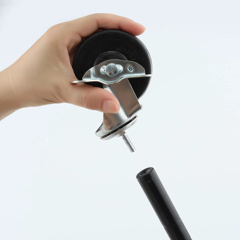 Hand holding caster wheel with universal thread, part of Set Of Four Caster Wheels For Organization And Storage Shelving.