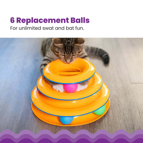 Cat playing with orange tower toy featuring Replacement Balls for Cat Track Toys, Multiple Colors, 6 Pack, on wooden floor.