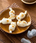 Plate with cat-shaped mashed potatoes next to Cat Shaped Rice Molds Set Of 2 For Fun Meal Prep And Kid Friendly Creative Lunches WHFCBJBW