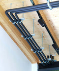 Ten-piece universal tube clamps deliver secure, corrosion-resistant support for Unistrut channels; 2 inch wall mount conduits, installed.