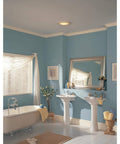 Bathroom with installed Round White Bath Exhaust Fan With Light And Glass Lens, 100 CFM, 3.5 Sones, 4 Inch Duct on ceiling.