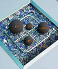 12 Pack Ceramic Balls, Mixed of 4 Size Fireplace Balls, black ceramic balls arranged on glass pebbles in fire pit