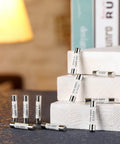 FF10A 600V Fast Blow Ceramic Fuses For Multimeters DMMs 6.3x32 Mm 10 Amp displayed on books in warm lighting.