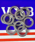 10-Pack Ceramic Bearings 6700ZZ 10x15x4 Shielded Ball Bearings stacked on a blue and red background