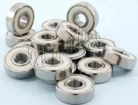 100-Pack Skateboard/inline/Rollerblade Skate/Fidget Ceramic Bearings Wholesale, multiple bearings on a blue background.