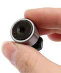 Close-up of 2pcs CF8 KR19 Cam Follower Needle Roller Bearing With M8x1.25mm Male Thread, 19mm Roller Diameter, held between fingers