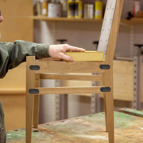 Chair with installed ✝️ 8 Sets 4 Inch Stainless Steel Flat Plate Straight Bracket Flat Metal Brace Bracket, 100mm Metal Brackets Mending Repair Plate Brace with Screws for Wood Straight Brace (Black) in workshop