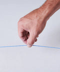 Hand holding blue line from Durable ABS Tuff Line contractor chalk reel delivers precise layout marking, ideal for construction.