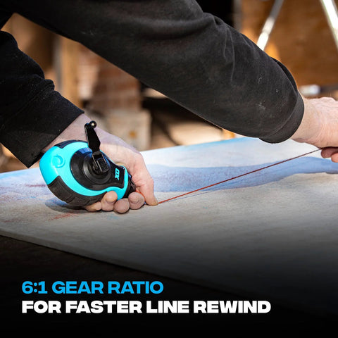 Person using chalk line reel with blue chalk on surface, highlighting 6:1 gear rewind feature for fast line retrieval.