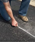 Person using Two Pack P100 Octagonal Chalk Line Reels 100 Foot Length 1.5mm String for precise layout on pavement
