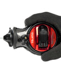 Hand holding Chalk Line Jam Free Special Edition With Extra Bold One Millimeter Line And Five Gear Quick Retrieval tool