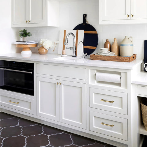 Sleek kitchen featuring Ten Pack Champagne Bronze Cabinet Handles Five Inch Length 128mm Screw Spacing Zinc Alloy on white cabinets.