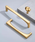 Champagne Bronze Oval Cabinet Knobs 10 Pack Single Hole Cabinet Pulls with rectangular handles on a light surface