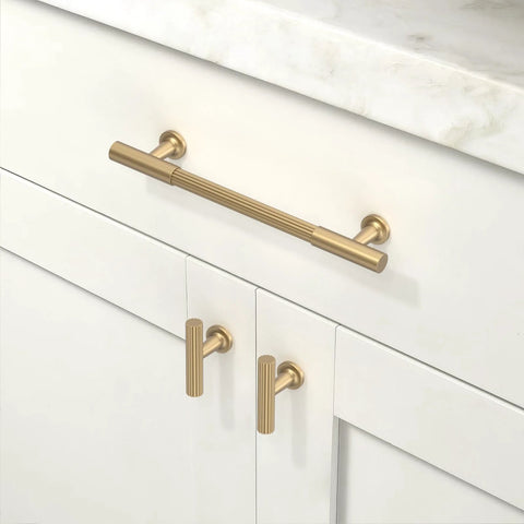 10 Pack Champagne Bronze Cabinet Pulls 5 Inch 128mm installed on white kitchen cabinet with marble countertop