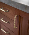 Champagne Bronze Cabinet Pulls 3 Inch Twisted Wave Design Set of 6 Zinc Alloy Drawer Handles on wood cabinet