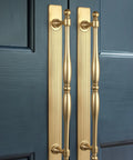 Champagne Bronze Cabinet Pulls With Backplates Modern Zinc Alloy Drawer Handles installed on blue cabinet doors