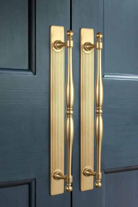 Champagne Bronze Cabinet Pulls With Backplates Modern Zinc Alloy Drawer Handles installed on blue cabinet doors