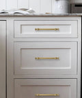 Champagne Bronze Cabinet Pulls In 5 Inch Hole Center For Cupboard And Drawer 10 Pack Solid Zinc Alloy installed on white drawers